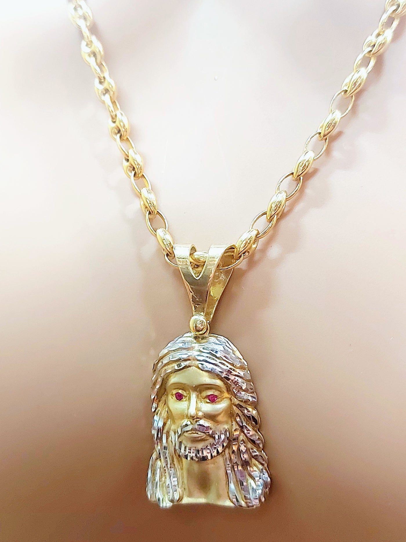 Jesus head with ruby eyes gold pendant