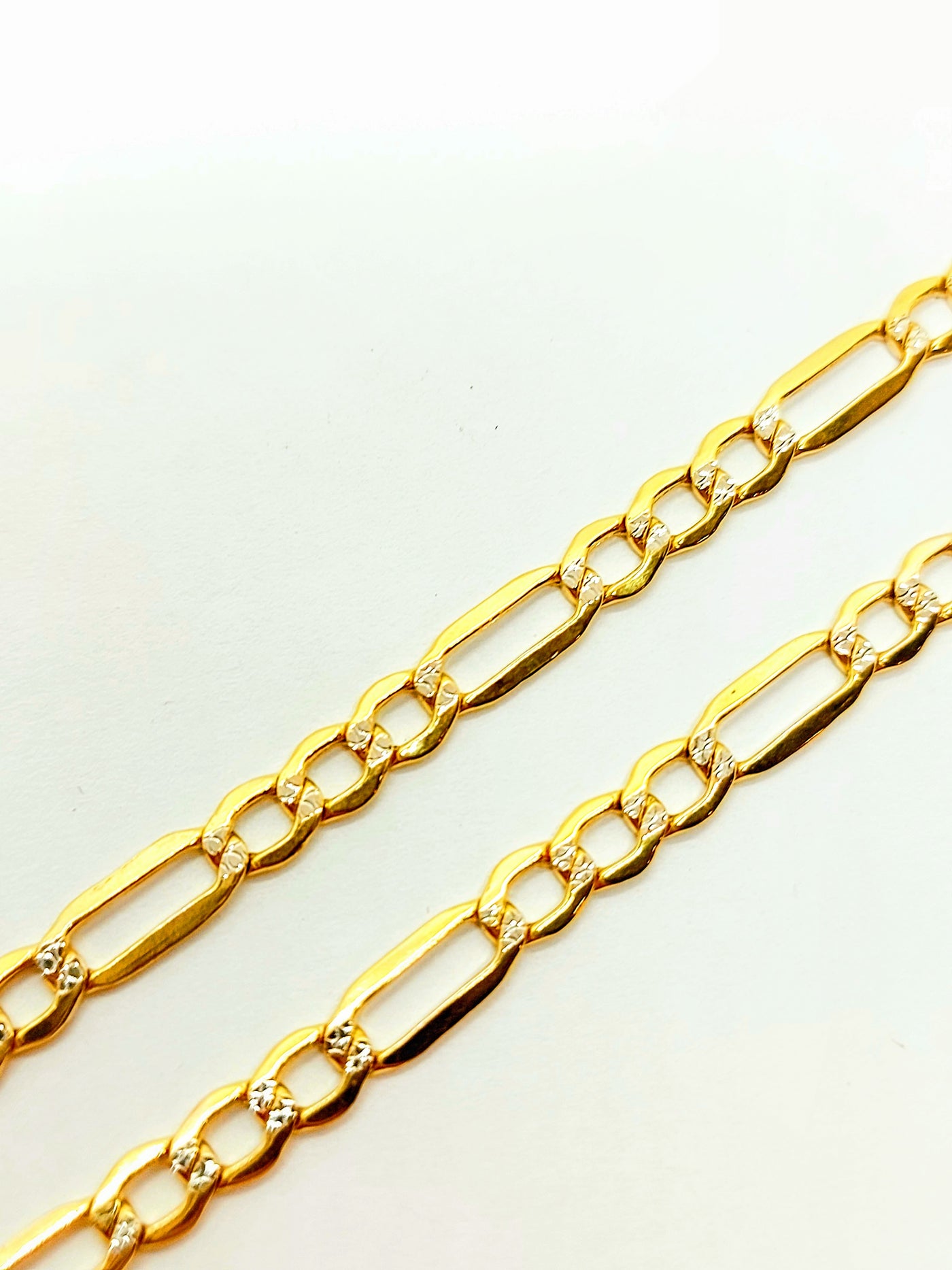 10k Gold Figaro chain with Diamond cut