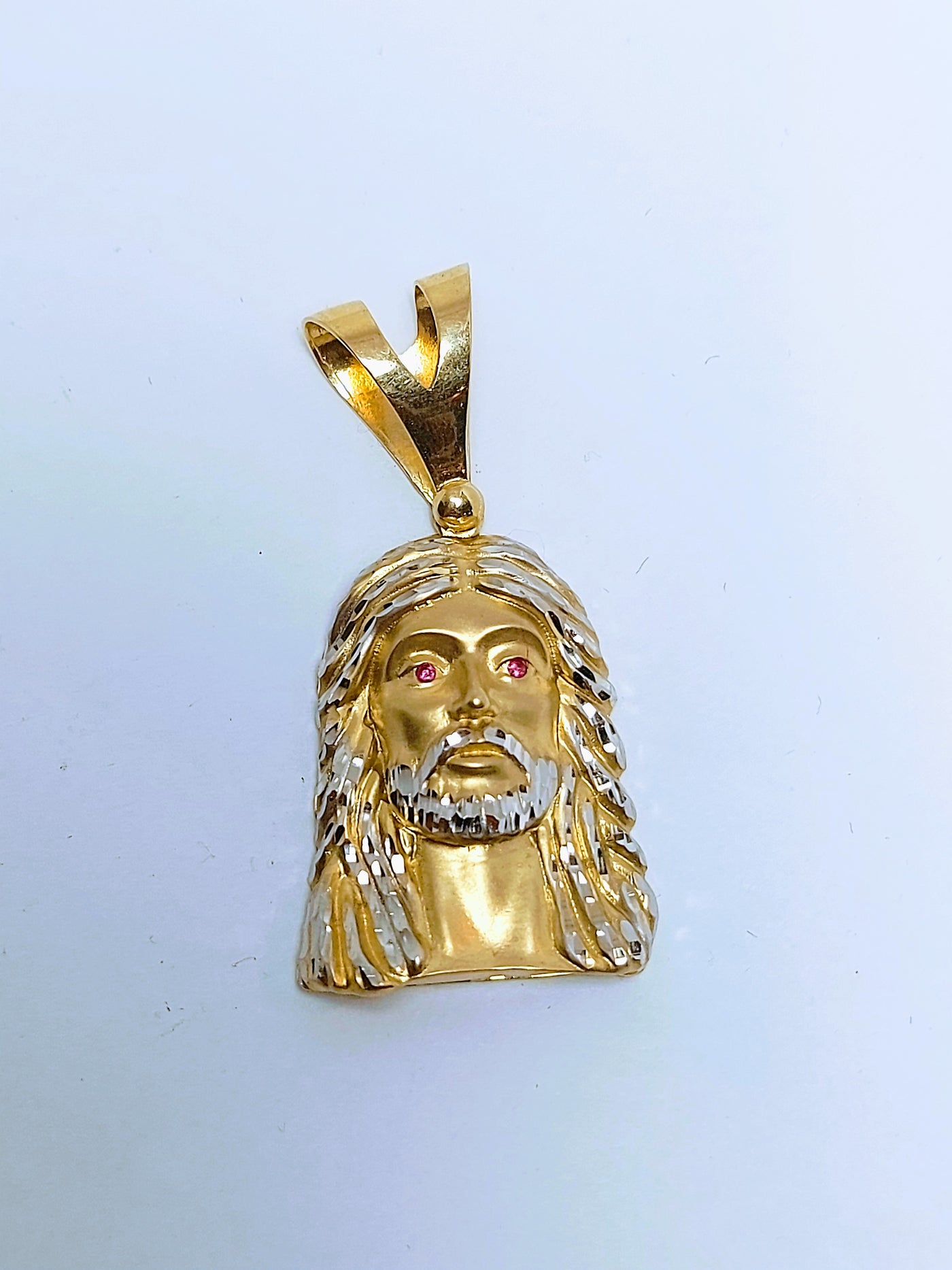 Jesus head with ruby eyes gold pendant