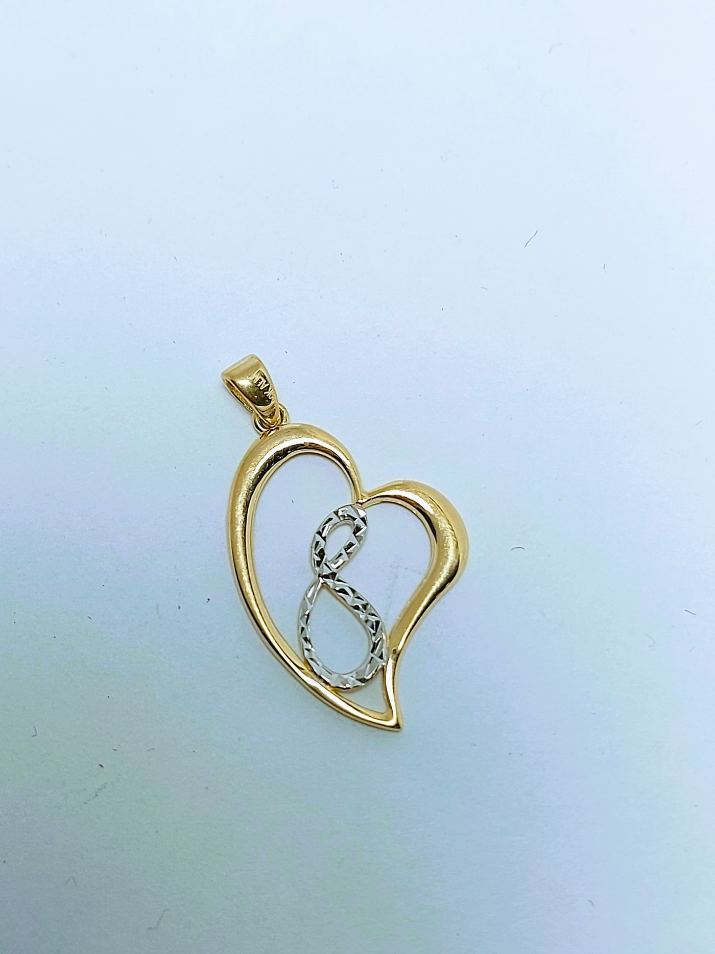 Heart with infinity inside gold pendant