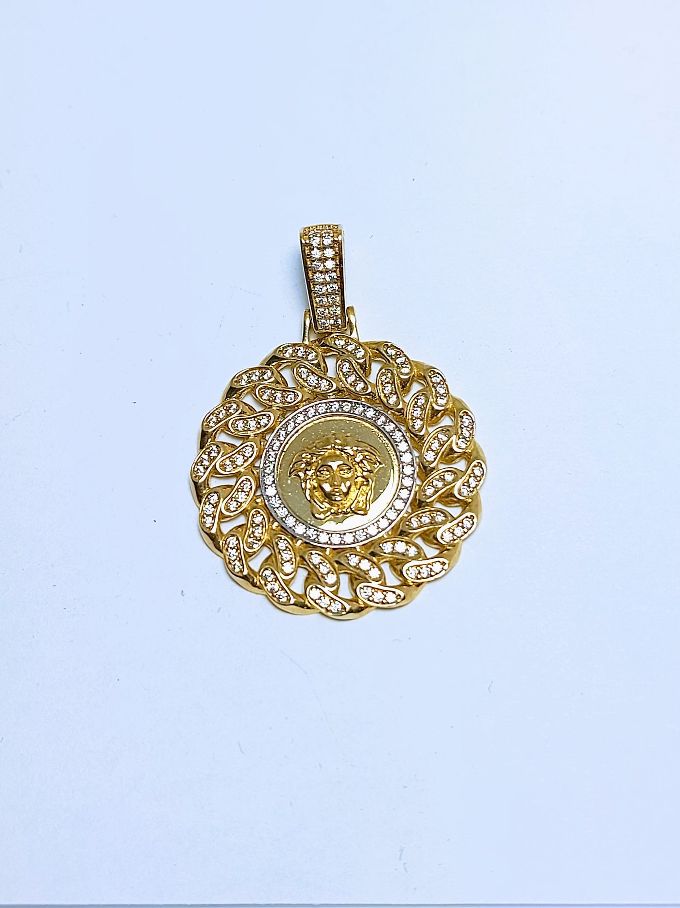 Gold Round shaped pendant with Cuban link and Versace design pendant