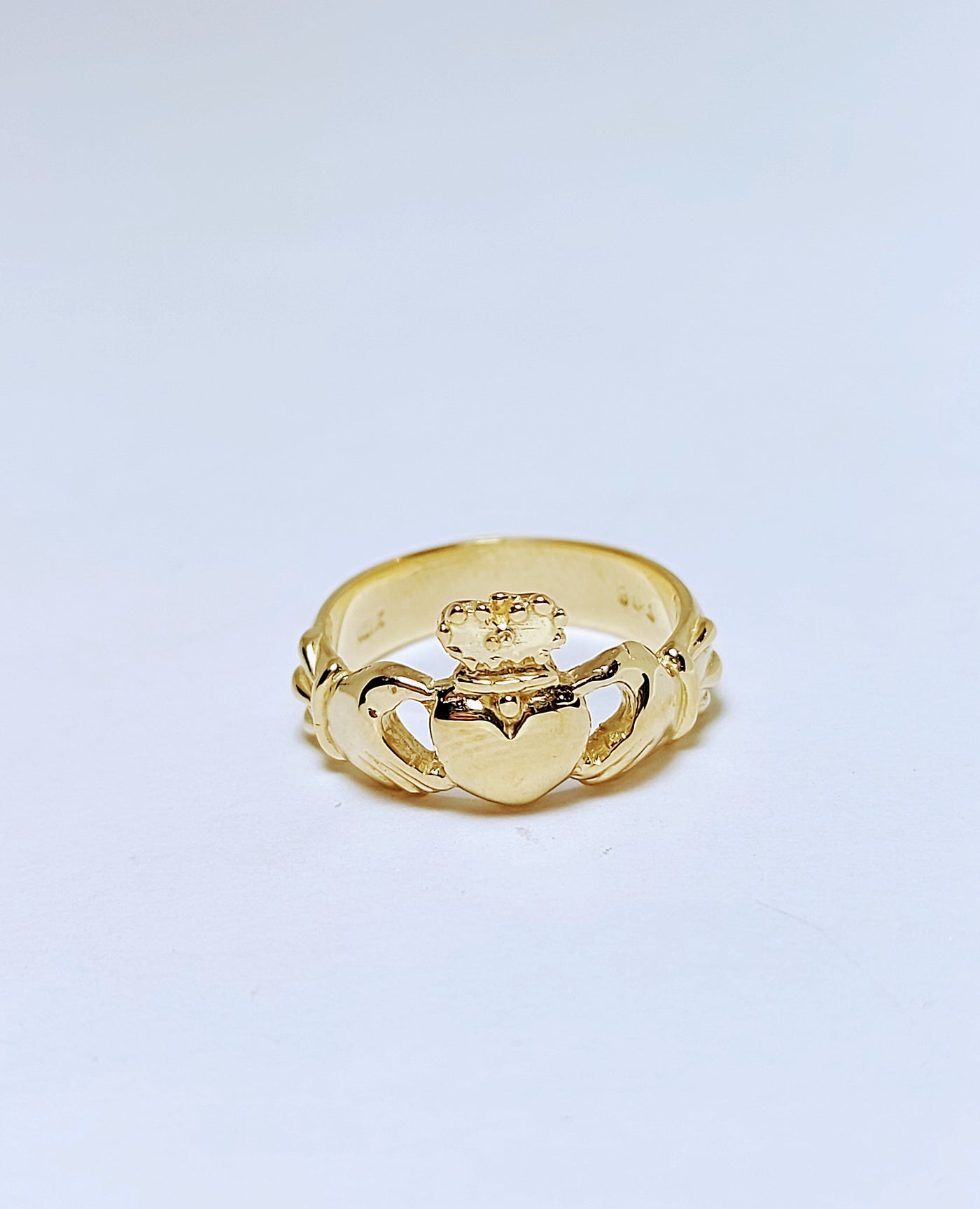 Gold ring with crown and heart