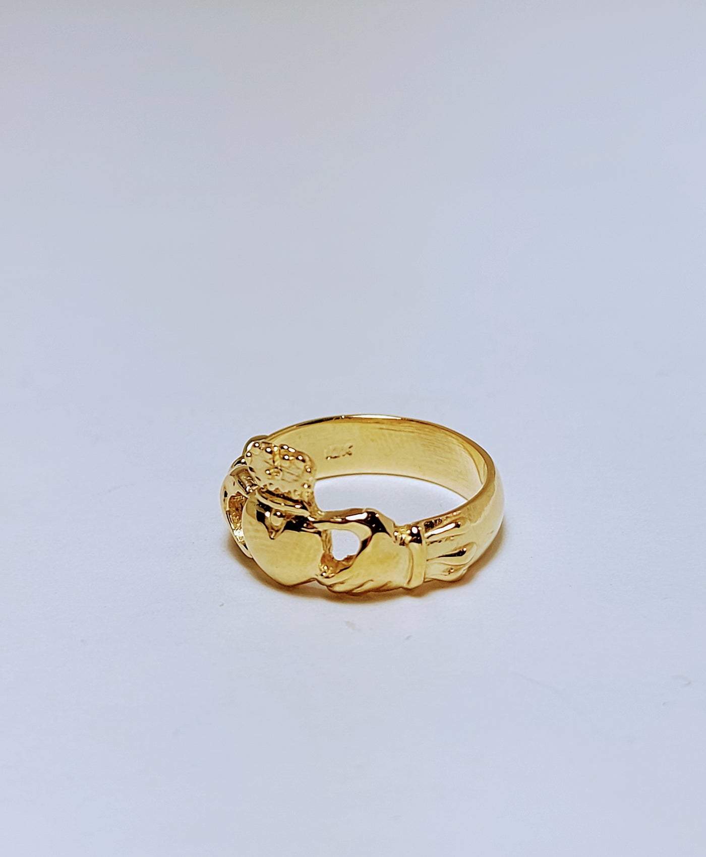 Gold ring with crown and heart