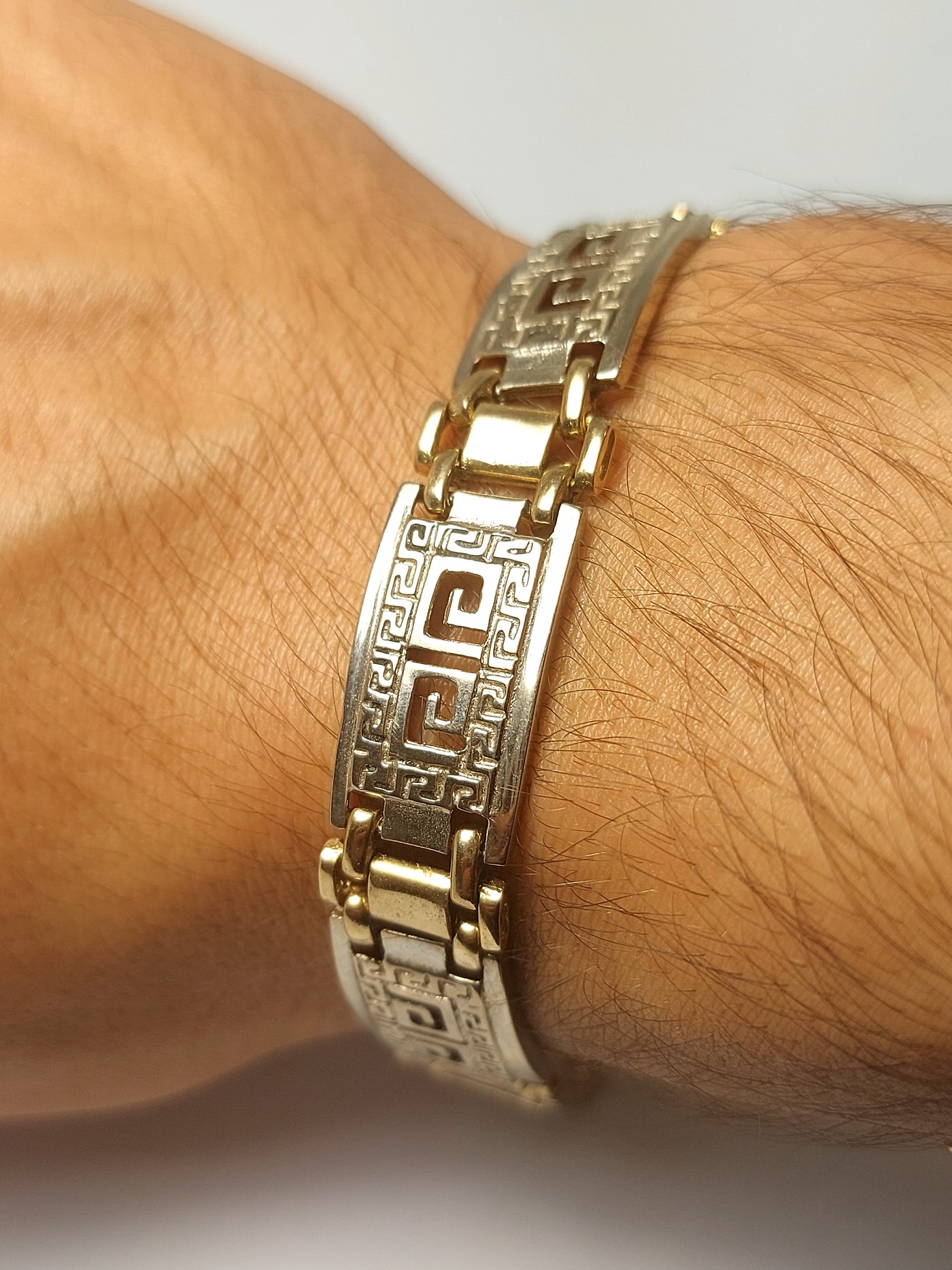 Men's gold bracelet with g lock and Greek design