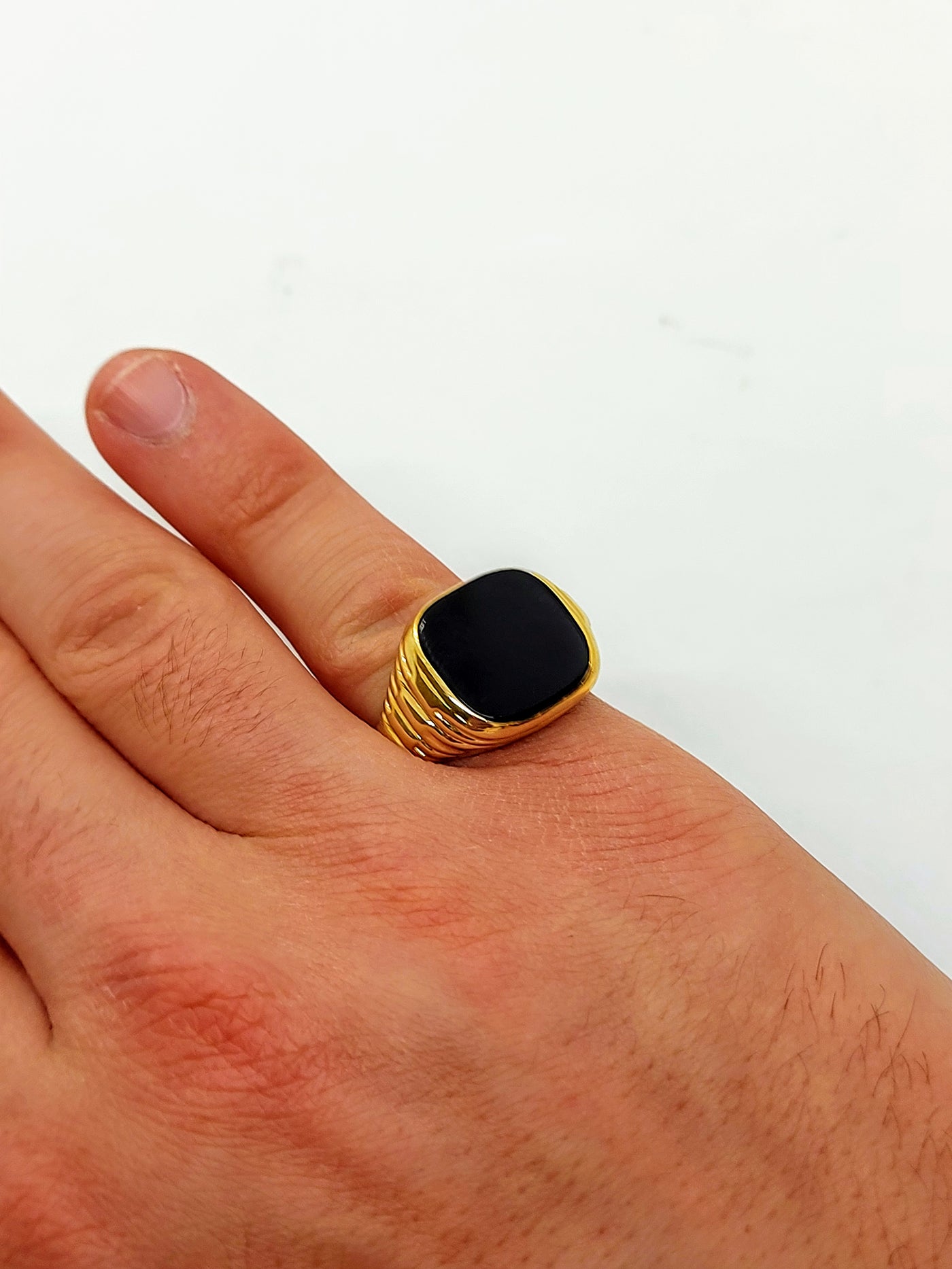 Gold men's ring with onyx stone